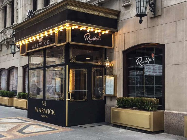 A winter vestibule/ seasonal enclosure for the Warwick by NYC Signs & Awnings